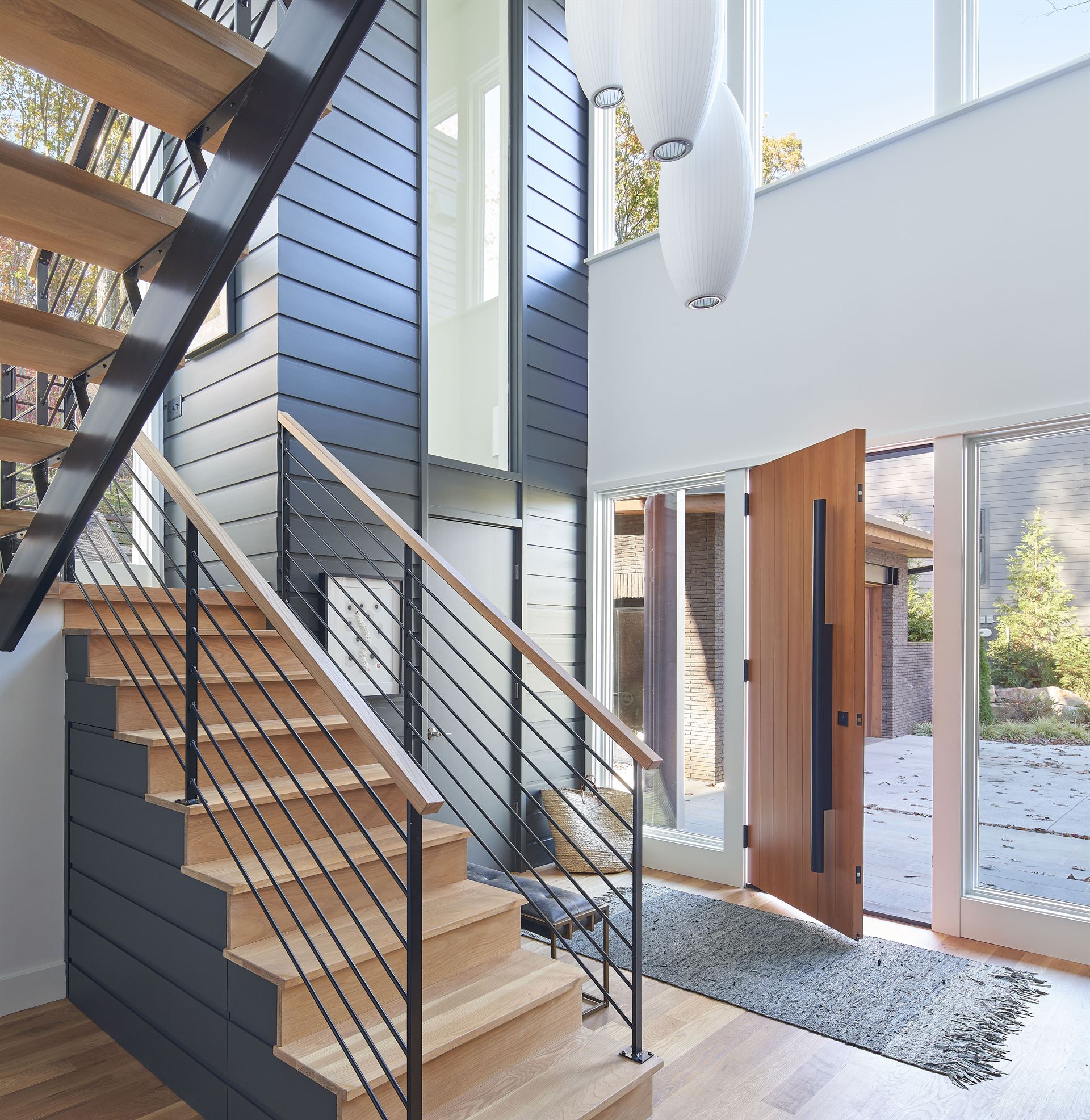 Foyer with slate colored Savannah Smooth on interior wall near staircase